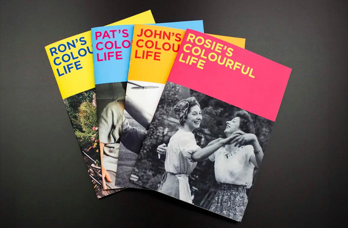 Display of four A colourful life colouring books, Ron's, Pat's, John's and Rosie's colourful life books.